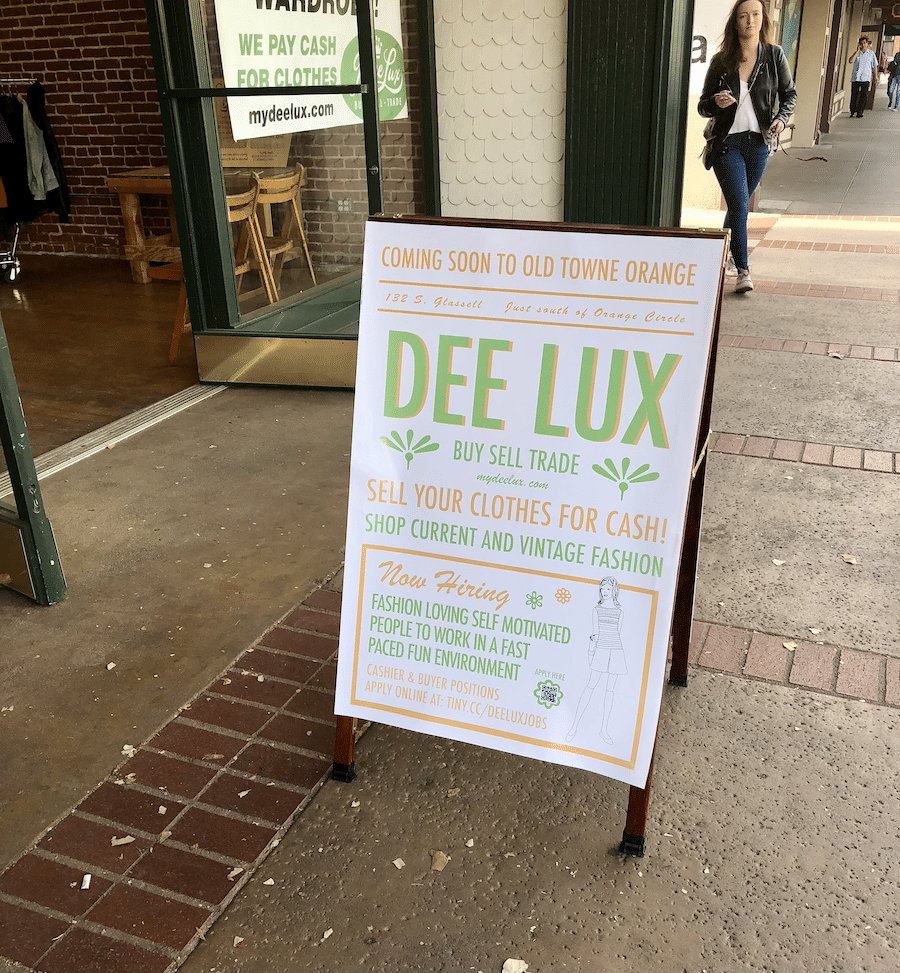deelux in old Towne orange with a sign on how to sell your clothes